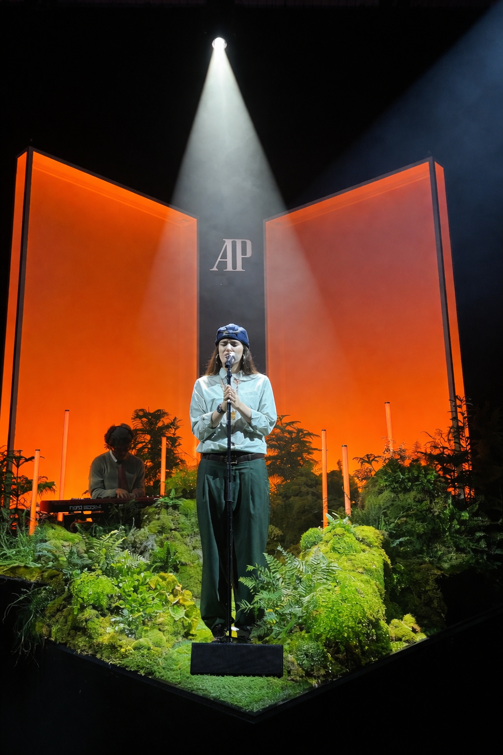 Performance stage with plant installation for brand activation 