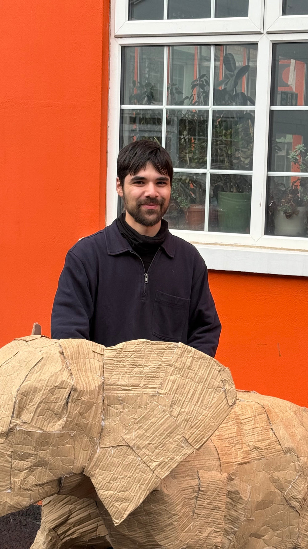 Multidisciplinary designed in front of a large cardboard elephant in front of our floral studio